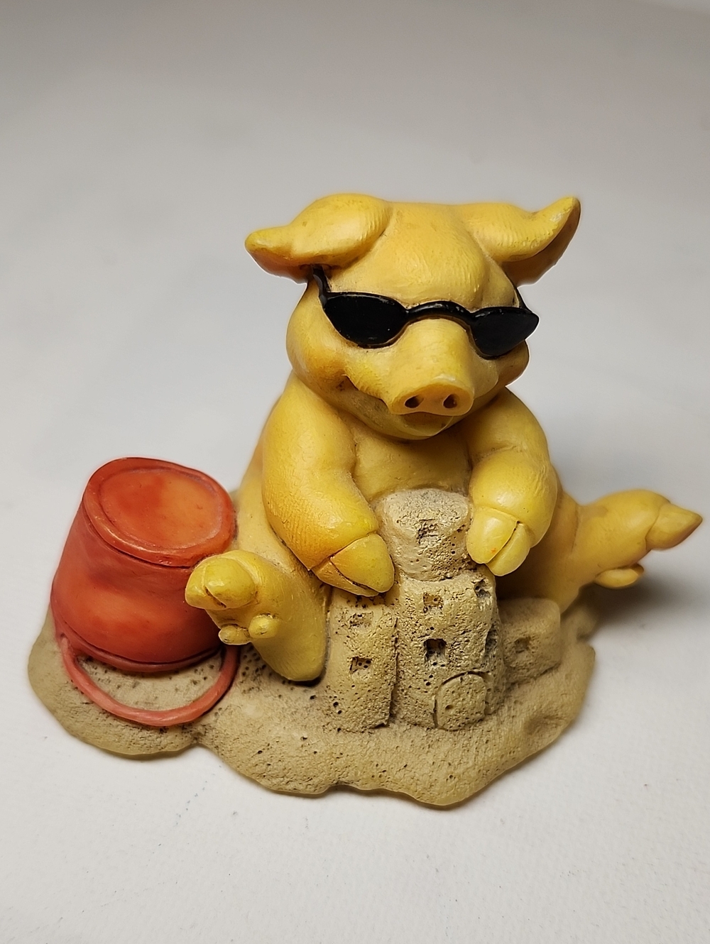 Pigsville  Yellow Pig Figurine Beach Toy Decor with Orange Bucket